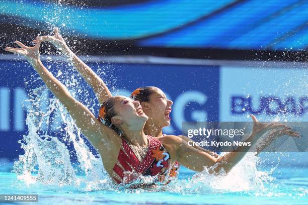 Japan's Megumu Yoshida and Moe Higa compete in the finals of the women's duet technical artistic swimming event during the world swimming...