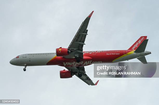 VietJet Air passenger plane approaches for landing at Singapore Changi Airport in Singapore on June 20, 2022.