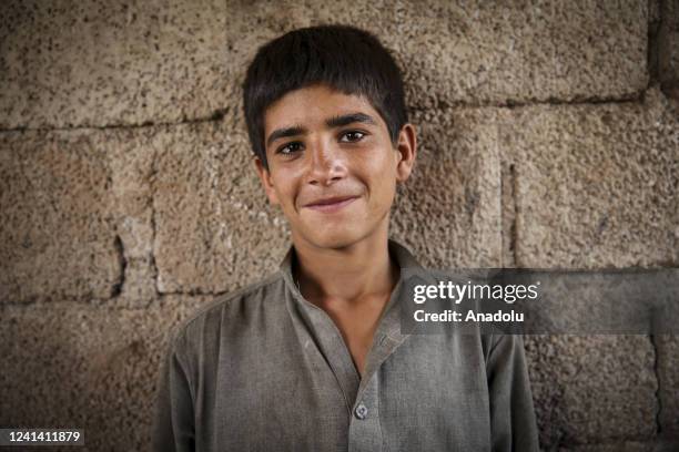 Composite image shows an Afghani children living at a camp poses for a photo in Islamabad, Pakistan on June 08, 2022. After the SovietâAfghan War in...