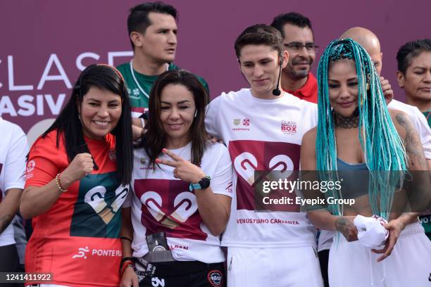Female boxers Ana Maria Torres, Jackie Nava and Mariana Juarez 'Barbie' during the massive boxing class in the Mexico City zocalo, where the new...