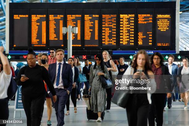 Commuters walk along the concourse after arriving at London Waterloo railway station in London, UK, on Monday, June 20, 2022. Britain's biggest train...