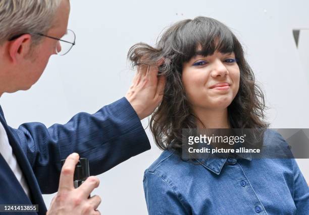 Steven Meth, Art Director of the Central Association of the German Hairdressing Trade, styles the new hairstyle trend Bangs Bangs for spring/summer...