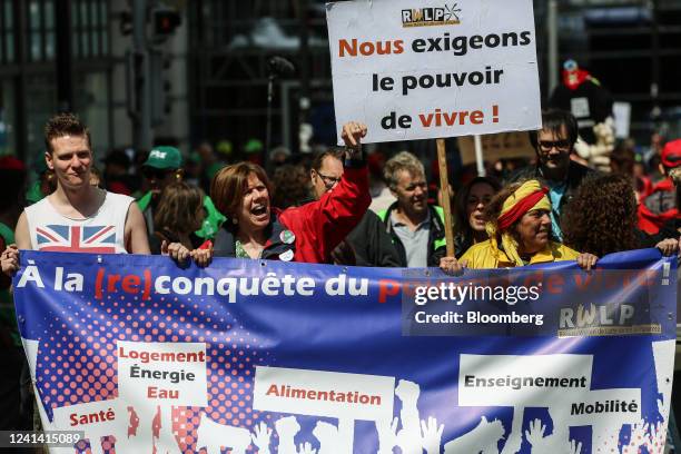 Demonstrator holds a sign highlighting the cost of living during a day of national strike action in Brussels, Belgium, on Monday, June 20, 2022. The...