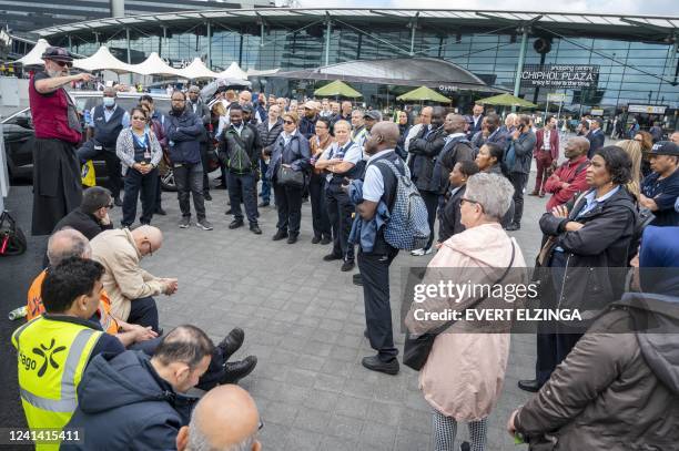 Schiphol Airport cleaning staff protest outside the airport in The Netherlands, on June 20 as they temporarily stopped working due to dissatisfaction...