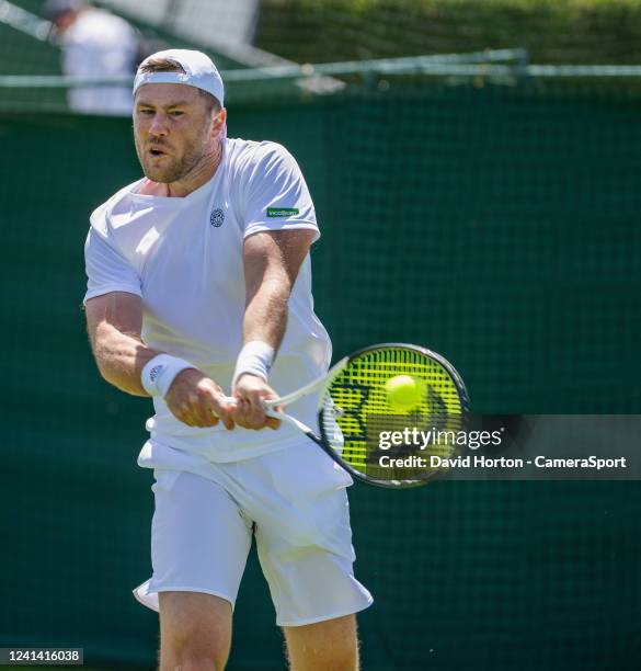 Illya Marchenko in action against Jesper De Jong in the first round of men's singles matches of the Wimbledon 2022 qualifying tournament at the Bank...