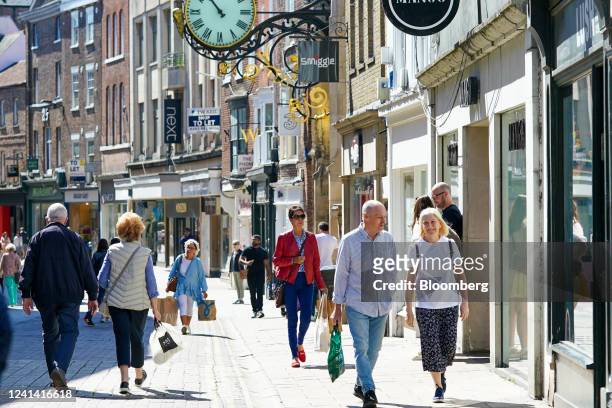 Shoppers walk along a retail street in the city centre of York, UK, on Monday, June 20, 2022. On Wednesday, inflation is set to rocket to a new...