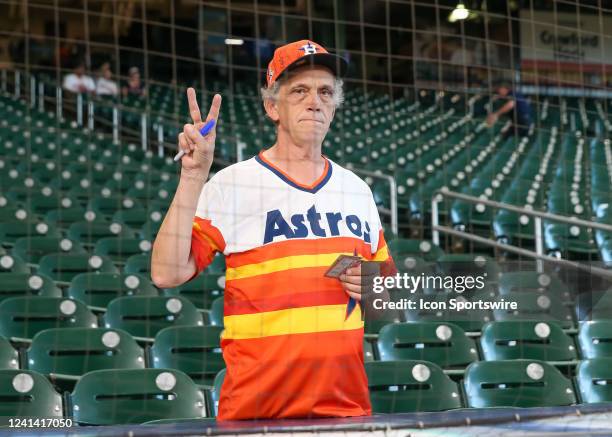 Baseball fan waits for players to sign baseball cards during the baseball game between the Chicago White Sox and Houston Astros on June 19, 2022 at...