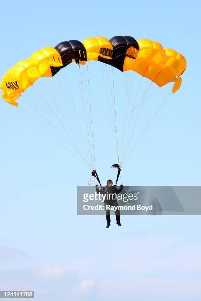 Member of The U.S. Army Parachute Team Golden Knights performs during the 53rd Annual Chicago Air & Water Show over North Avenue Beach in Chicago,...