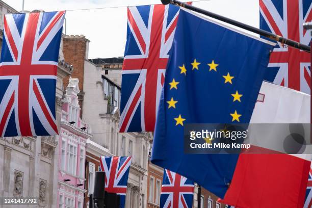 European Union flag hangs alongside Union Jack flags on Piccadilly on 1st June 2022 in London, United Kingdom.