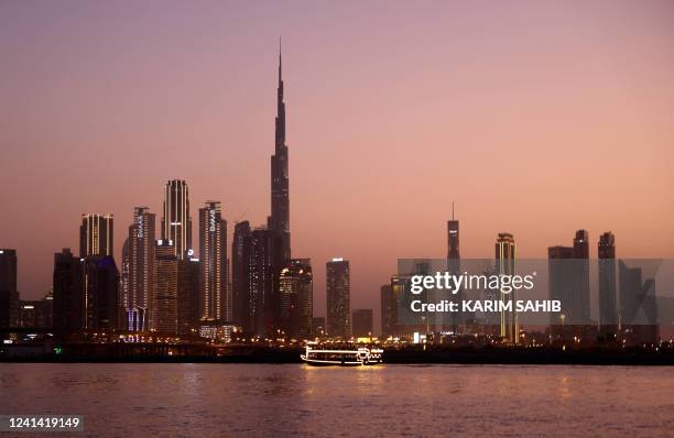 Picture shows a view of the Dubai skyline, including Burj Khalifa the world's tallest building, in the United Arab Emirates, on June 20, 2022.