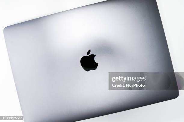 Apple logo is seen on MacBook in this illustration photo taken in Krakow, Poland on June 20, 2022.