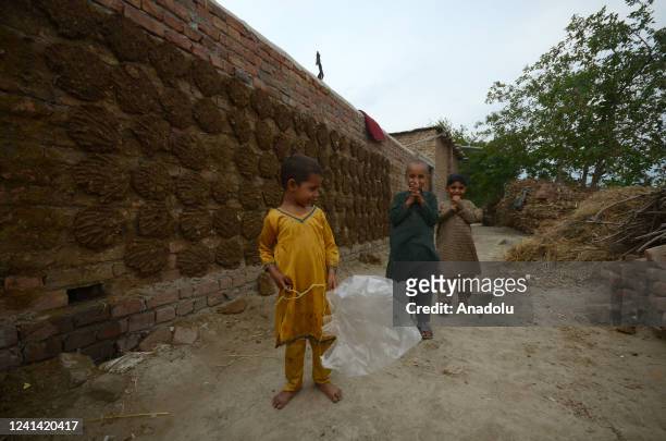 Refugees living in a camp near Pakistan's capital Peshawar are struggling with difficult conditions in Peshawar on June 20, 2022. Pakistan hosts more...