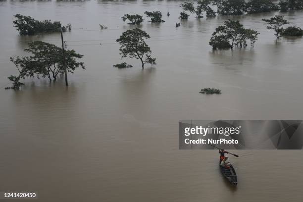 An aerial shot of flooded area following heavy monsoon rainfalls in Companiganj on June 20, 2022. - At least 26 more people have died in monsoon...
