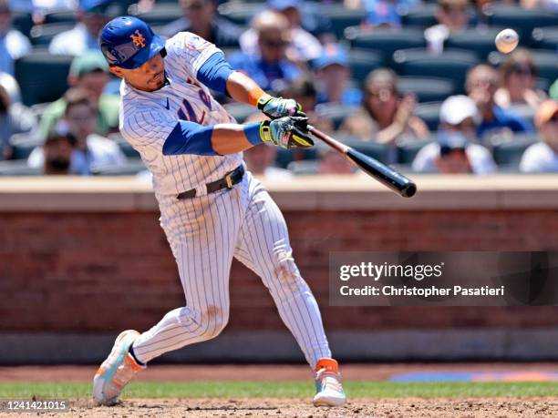 Eduardo Escobar of the New York Mets hits an RBI sacrifice fly in the bottom of the fourth inning against the Miami Marlins at Citi Field on June 20,...