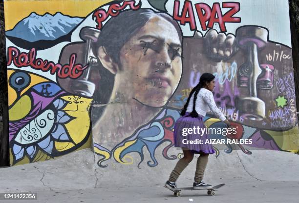 Member of the indigenous Bolivian women's skateboard collective "Imilla Skate," created by two friends in 2019 in Cochabamba, skates in La Paz on...