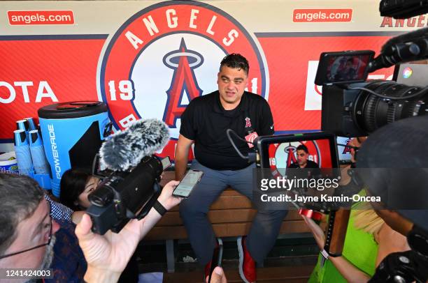 General manager Perry Minasian of the Los Angeles Angels talks to the media before the game against the Kansas City Royals at Angel Stadium of...
