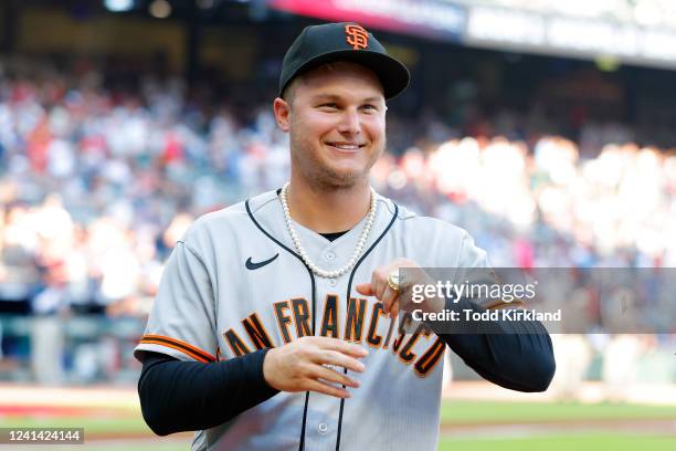 Joc Pederson of the San Francisco Giants receives his World Series Championship ring from the 2021 season with the Atlanta Braves prior to the game...