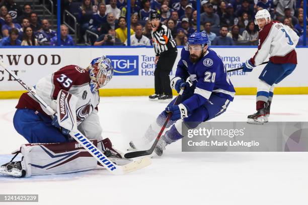 Nicholas Paul of the Tampa Bay Lightning skates against goalie Darcy Kuemper of the Colorado Avalanche in Game Three of the 2022 Stanley Cup Final at...