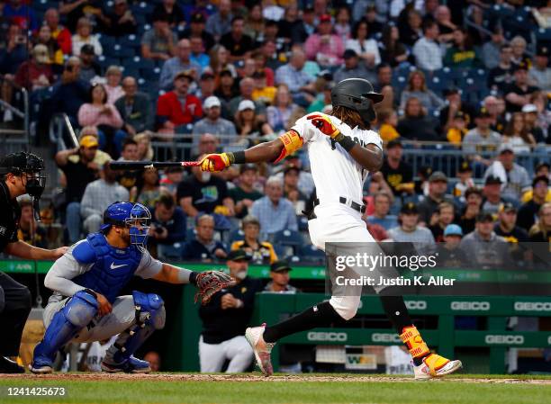 Oneil Cruz of the Pittsburgh Pirates hits a RBI single in the seventh inning against the Chicago Cubs during the game at PNC Park on June 20, 2022 in...