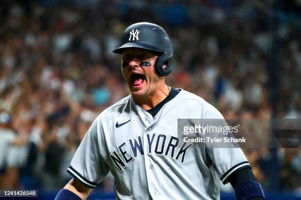 Josh Donaldson of the New York Yankees reacts after scoring on a triple by Aaron Hicks during the game between the New York Yankees and the Tampa Bay...
