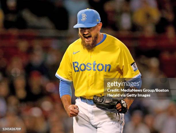 John Schreiber of the Boston Red Sox screams out after getting out of the eighth inning and striking out Victor Reyes of the Detroit Tigers at Fenway...