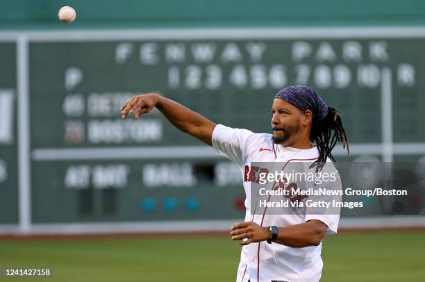 Manny Ramirez throws out the first pitch to David Ortiz before the MLB game against the Detroit Tigers at Fenway Park on June 20, 2022 in Boston,...