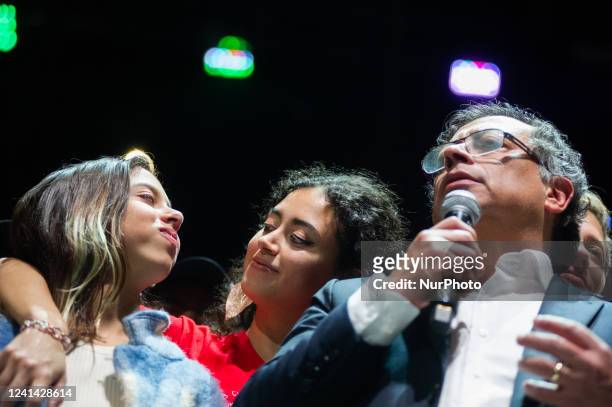 Antonella Petro and her sister Sofia Petro look at each other as her dad president elect Gustavo Petro gives a speech during the campaign celebration...