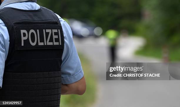 Police officer stands at a police border control station near Garmisch-Partenkirchen, southern Germany on June 20 a few days ahead of the start of...