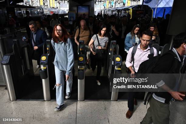 Passengers from Woking arrive at Waterloo Station in London on June 21, 2022 as the biggest rail strike in over 30 years hits the UK. Rush-hour...