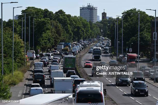 Cars queue in traffic in Hammersmith as commuters make their way to central London on June 21, 2022 amid the biggest rail strike in over 30 years to...