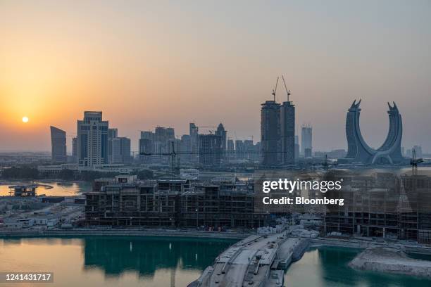 The Katara Towers, right, beyond major construction works in the Lusail development in Doha, Qatar, on Monday, June 20, 2022. About 1.5 million fans,...