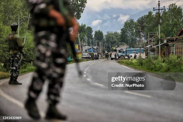 Indian Army Soldiers, CRPF and Jammu and Kashmir Police take stand alert near Gunfight site in Tulibal Sopore District Baramulla Jammu and Kashmir...