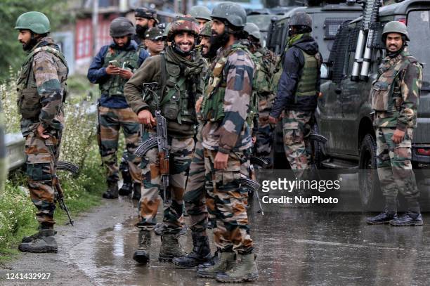 Indian Army Soldiers, CRPF and Jammu and Kashmir Police take stand alert near Gunfight site in Tulibal Sopore District Baramulla Jammu and Kashmir...