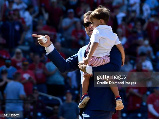 Former Washington National Ryan Zimmerman throws out the ceremonial first pitch with his son, Henry, prior to a game against the Philadelphia...