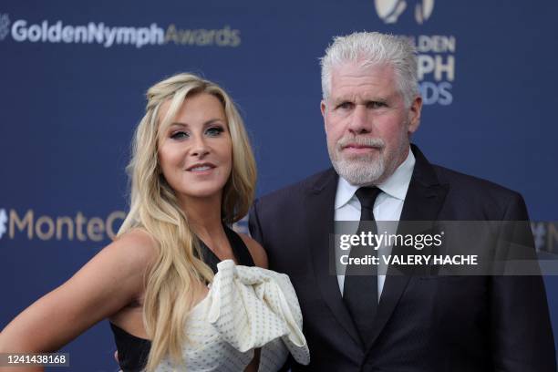 Actress Alison Dunbar and US actor and producer, former jury president Ron Perlman pose for a photograph during the closing ceremony of the 61th...