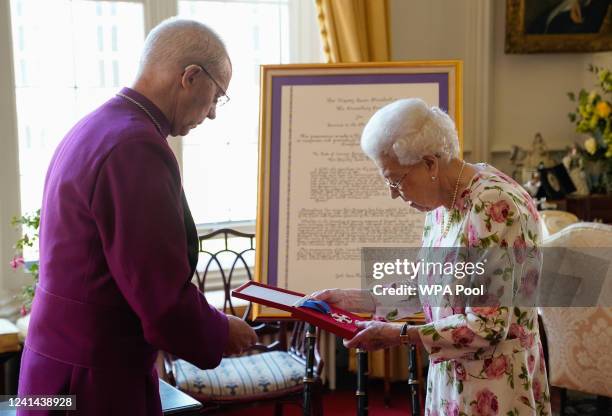 Queen Elizabeth II receives the Archbishop of Canterbury Justin Welby at Windsor Castle, where he presented her with a special 'Canterbury Cross' for...