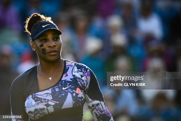 Player Serena Williams arrives on the court to play with Tunisia's Ons Jabeur for their round of 8 women's doubles tennis match against Spain's Sara...