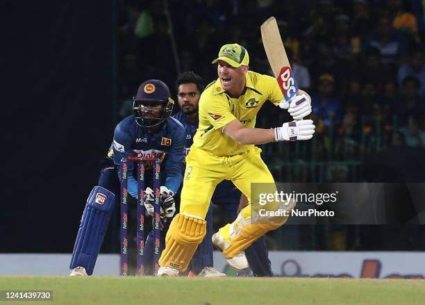 Australia's David warner plays a shot during the 4th One Day International match between Sri Lanka and Australia at R. Premadasa Stadium on June 21...