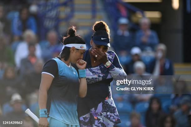 Player Serena Williams and Tunisia's Ons Jabeur react as they play against Spain's Sara Sorribes Tormo and Czech Republic's Marie Bouzkova during...