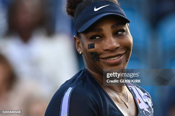 Player Serena Williams reacts as she plays with Tunisia's Ons Jabeur against Spain's Sara Sorribes Tormo and Czech Republic's Marie Bouzkova during...