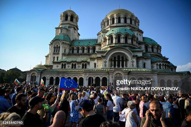People take part in a demonstration to support the government who is facing a no-confidence vote in Sofia on June 21, 2022. - Bulgaria's largest...