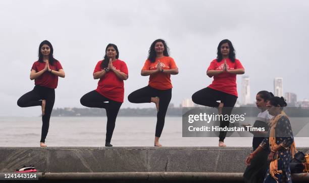 Health enthusiasts participate in a mass yoga session to celebrate International Yoga Day at Marine Drive on June 21, 2022 in Mumbai, India.