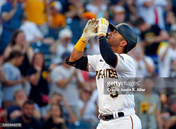 Michael Perez of the Pittsburgh Pirates reacts after hitting a solo home run in the second inning against the Chicago Cubs at PNC Park on June 21,...