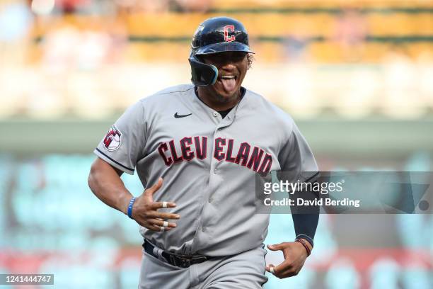 Josh Naylor of the Cleveland Guardians celebrates his two-run home run as he rounds the bases against the Minnesota Twins in the third inning at...