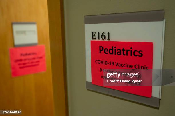 Signs direct patients to the pediatric Covid-19 vaccine clinic at UW Medical Center - Roosevelt on June 21, 2022 in Seattle, Washington. Covid-19...