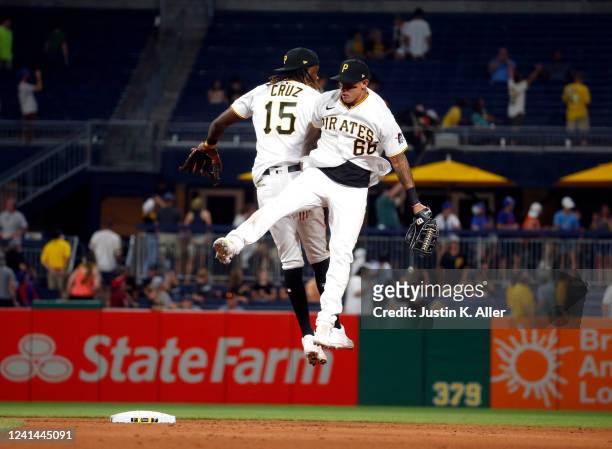 Bligh Madris and Oneil Cruz of the Pittsburgh Pirates celebrate after defeating the Chicago Cubs 7-1 at PNC Park on June 21, 2022 in Pittsburgh,...