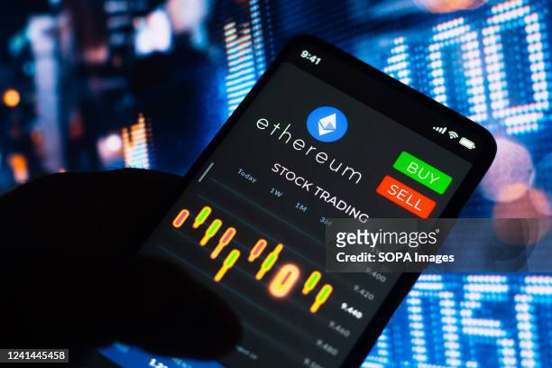 In this photo illustration, the stock trading graph of Ethereum seen on a smartphone screen.