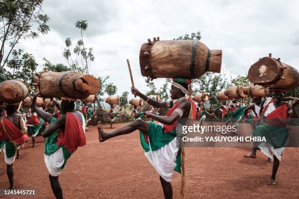 Elite drummers perform for tourists at Gishora Drum Sanctuary in Gishora, Burundi, on March 12, 2022. Against a backdrop of rolling green hills, a...
