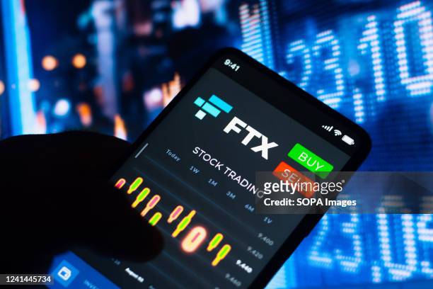In this photo illustration, the stock trading graph of FTX Token seen on a smartphone screen.