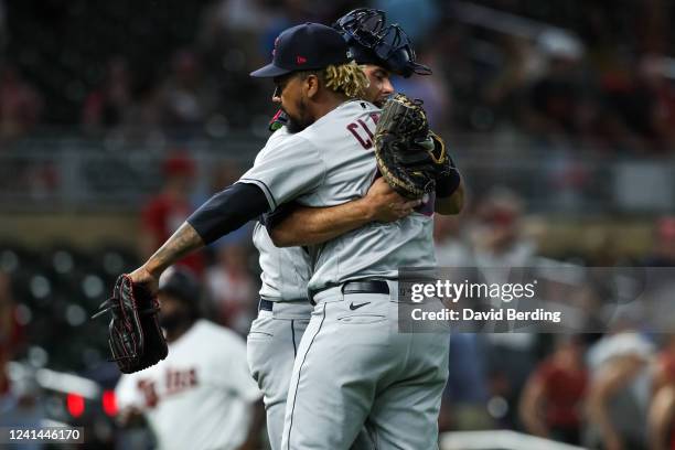 Luke Maile and Emmanuel Clase of the Cleveland Guardians celebrate a 6-5 victory in 11 innings against the Minnesota Twins at Target Field on June...